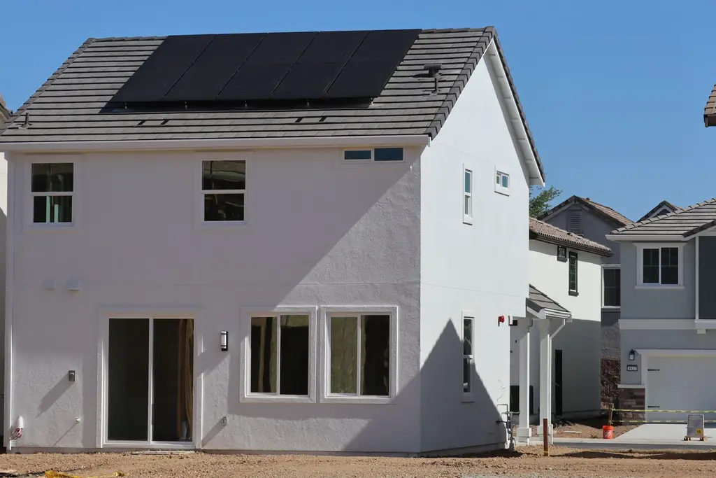 A new two-storey home in Elk Grove, California, with solar panels on the roof